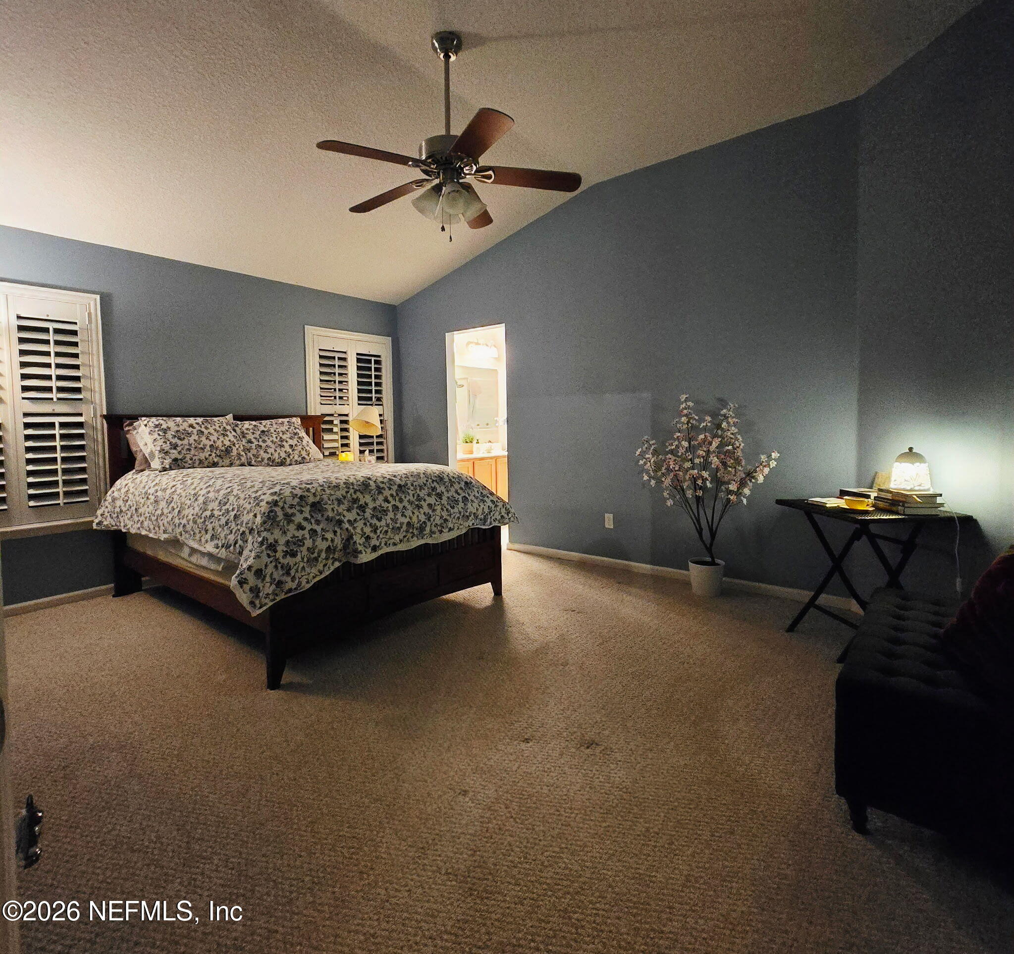 1424 Tintern Lane St. Augustine, FL 32092 - Photo 16 of 32 a bedroom with a bed and a chandelier