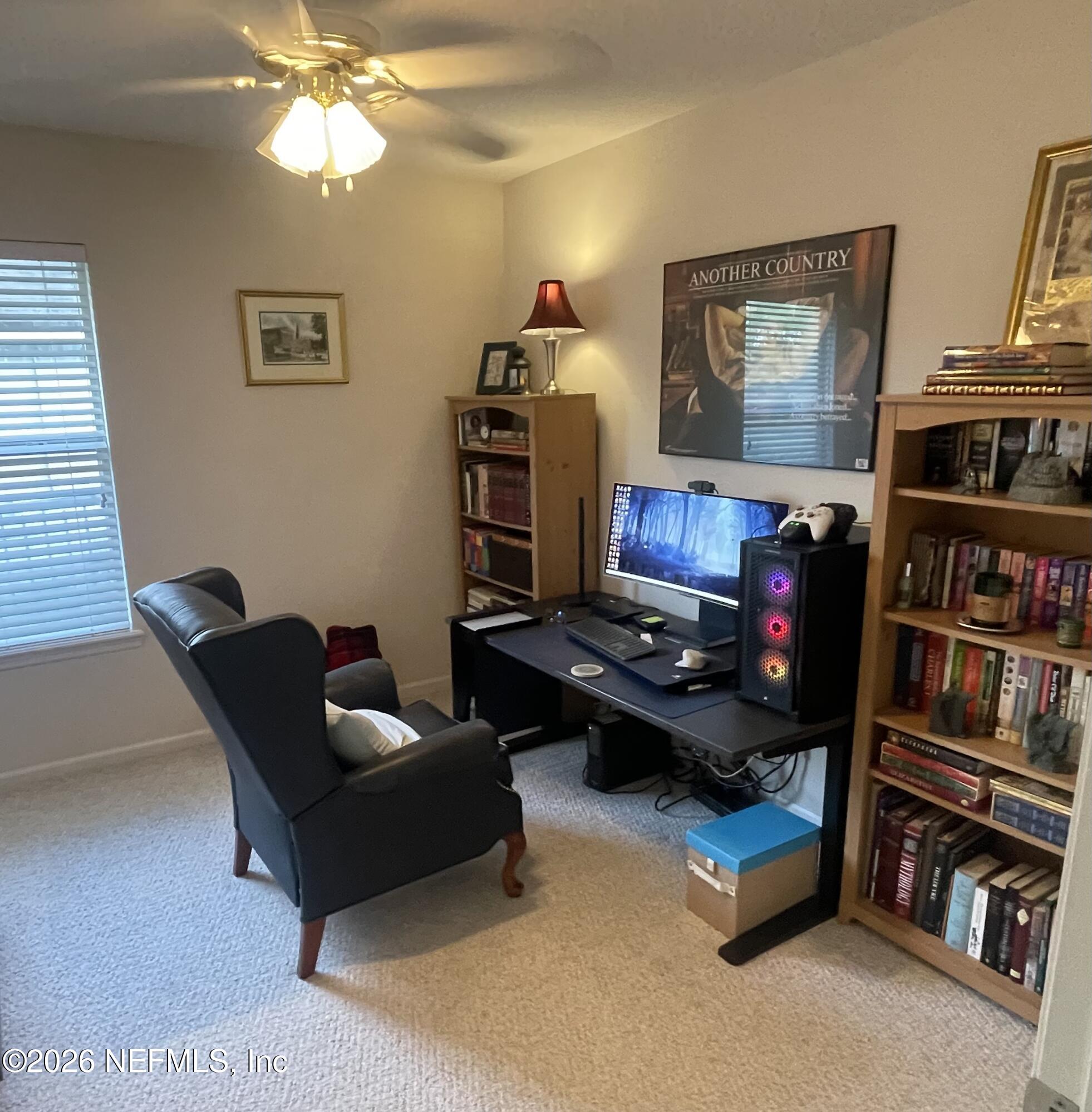 1424 Tintern Lane St. Augustine, FL 32092 - Photo 20 of 32 a living room with furniture workspace and a window