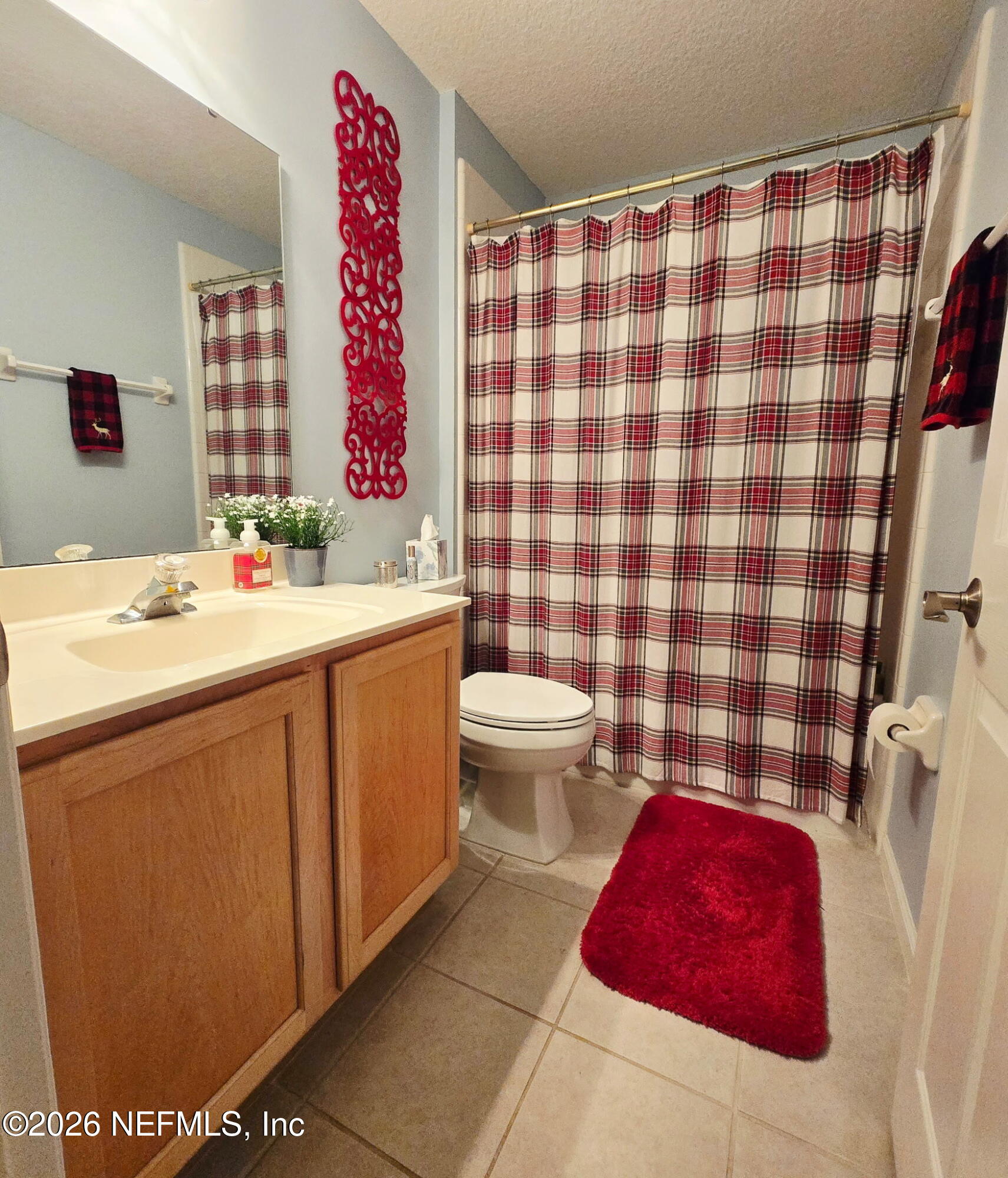 1424 Tintern Lane St. Augustine, FL 32092 - Photo 22 of 32 a bathroom with a sink toilet and shower