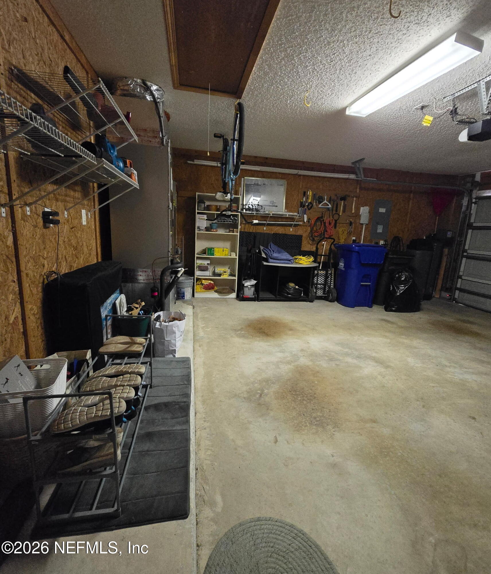 1424 Tintern Lane St. Augustine, FL 32092 - Photo 25 of 32 a view of a garage with a table and chairs