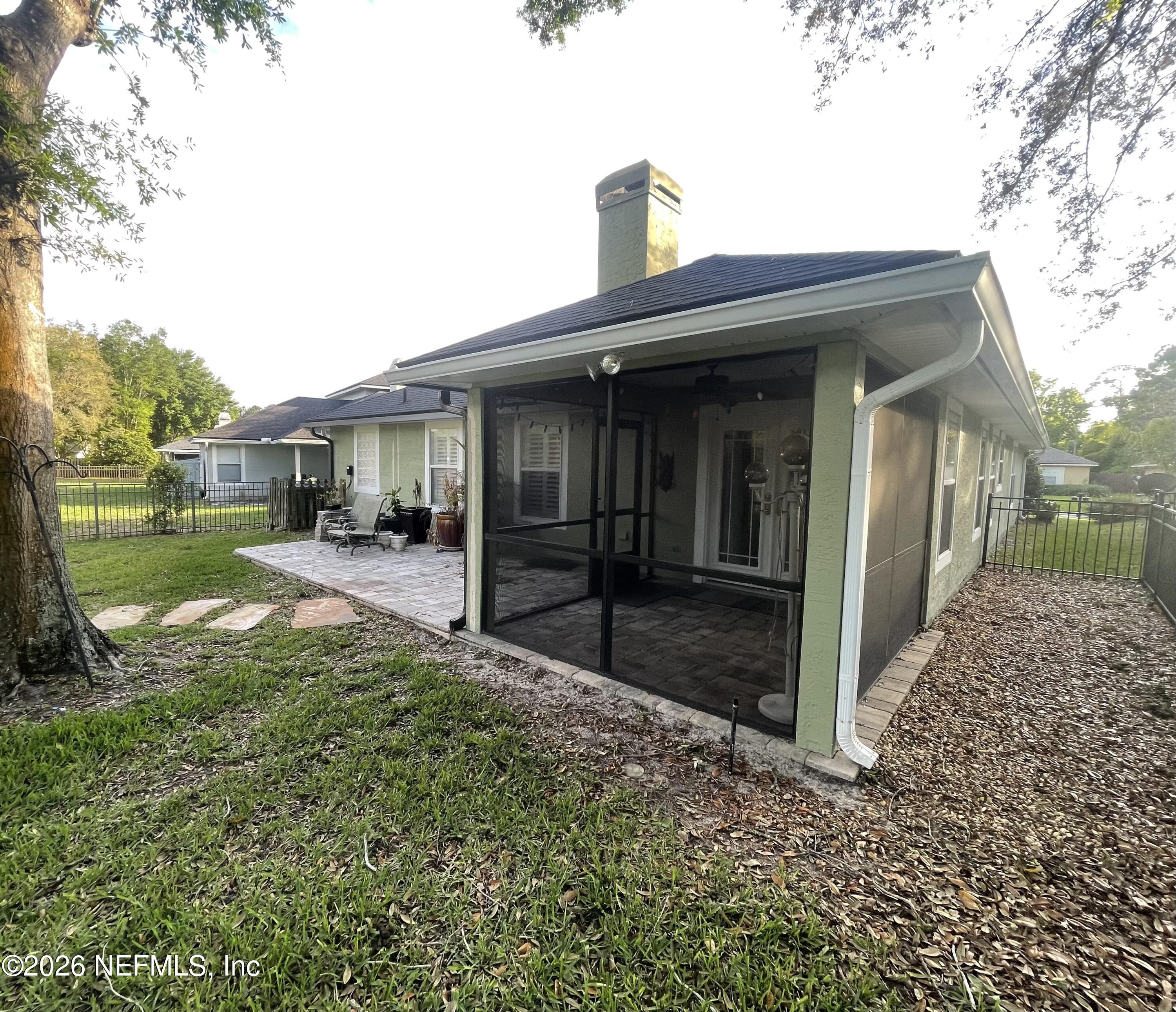 1424 Tintern Lane St. Augustine, FL 32092 - Photo 8 of 32 a view of a porch with a yard