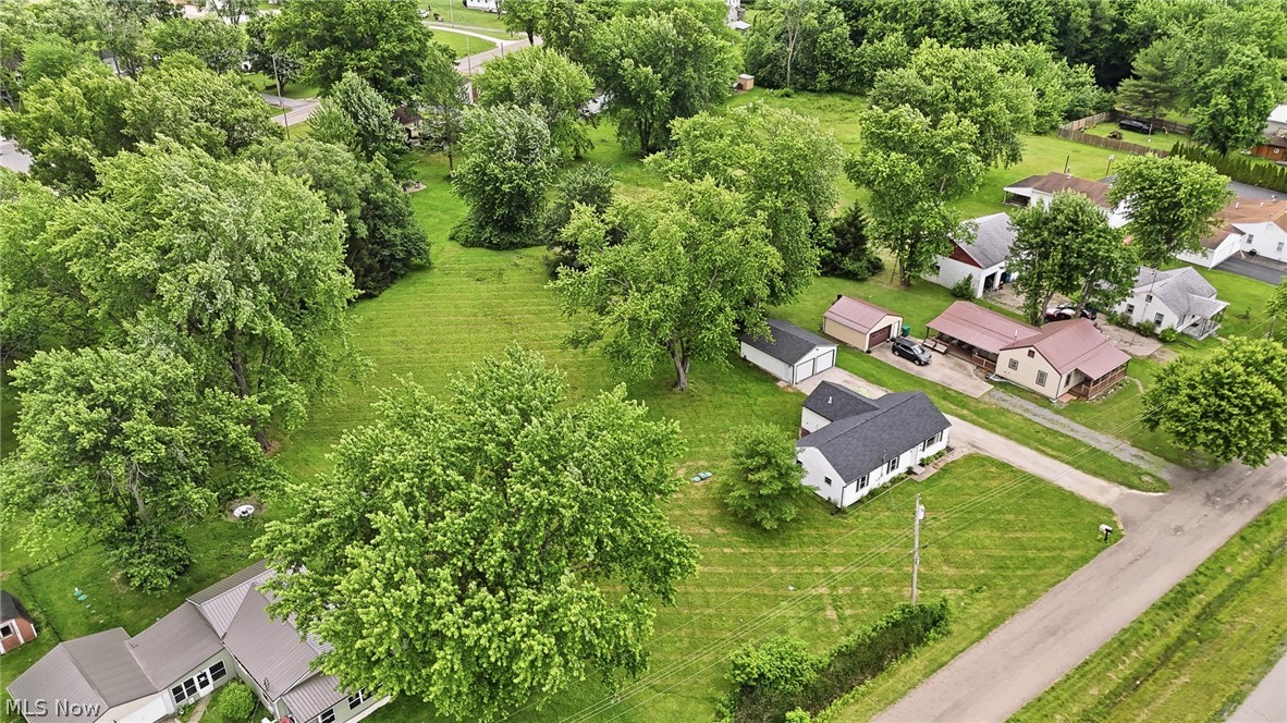 3471 State Rte 5 Newton Falls, OH 44444 - Photo 29 of 31 Aerial perspective showcasing a residential area with varied housing styles and mature trees