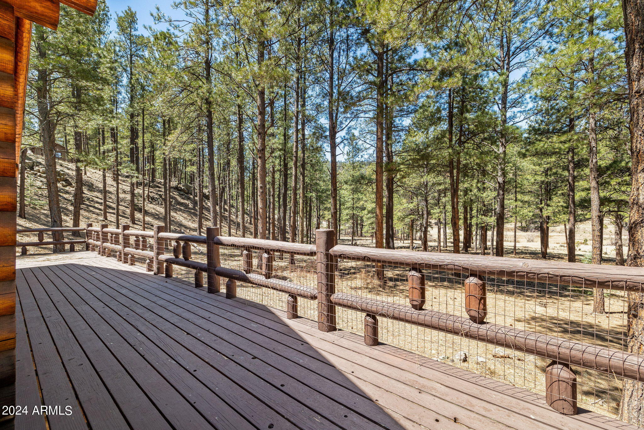 9 County Road Greer, AZ 85927 - Photo 15 of 33 a view of a roof deck with wooden floor and fence
