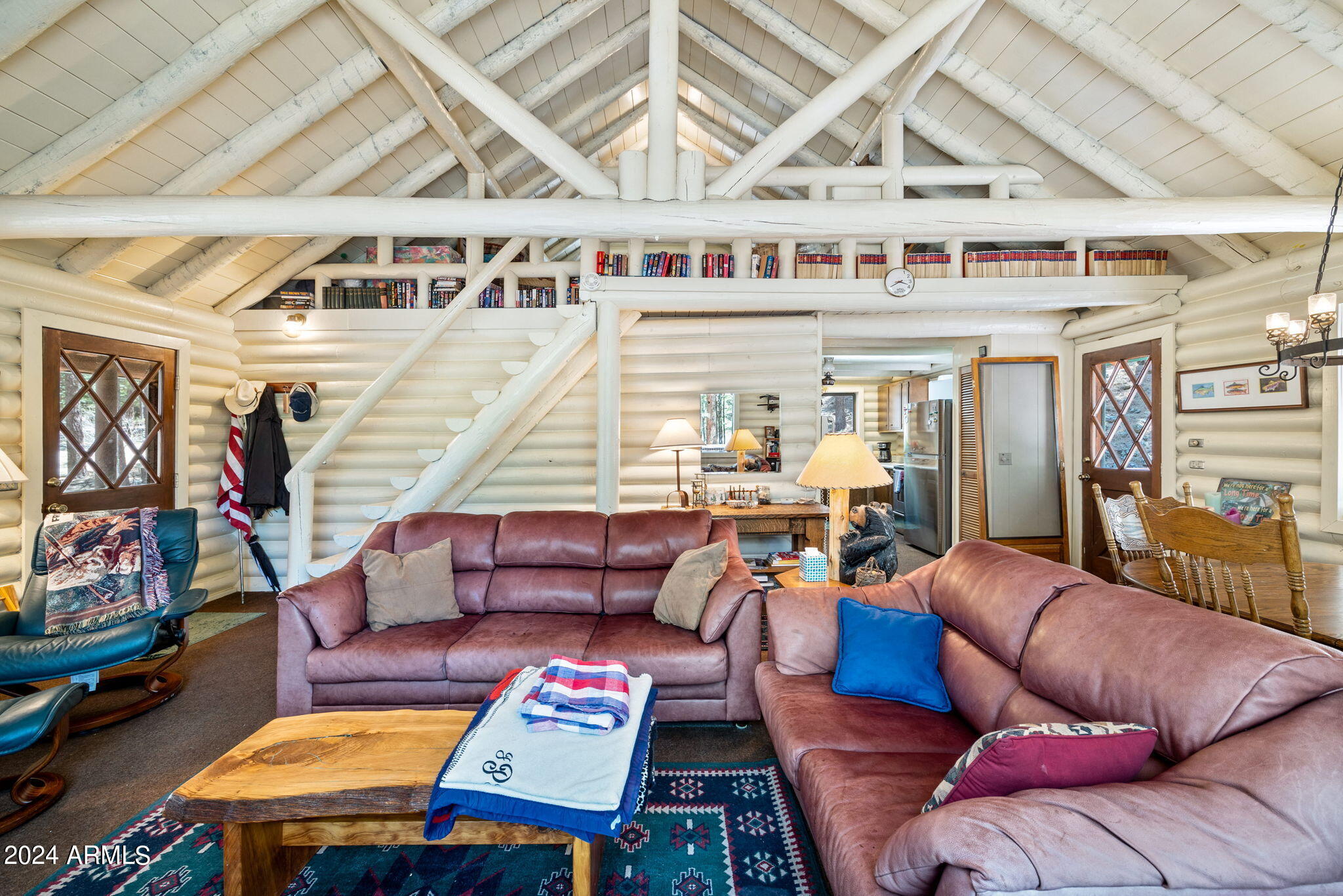9 County Road Greer, AZ 85927 - Photo 25 of 33 a outdoor living space with furniture and a flat screen tv