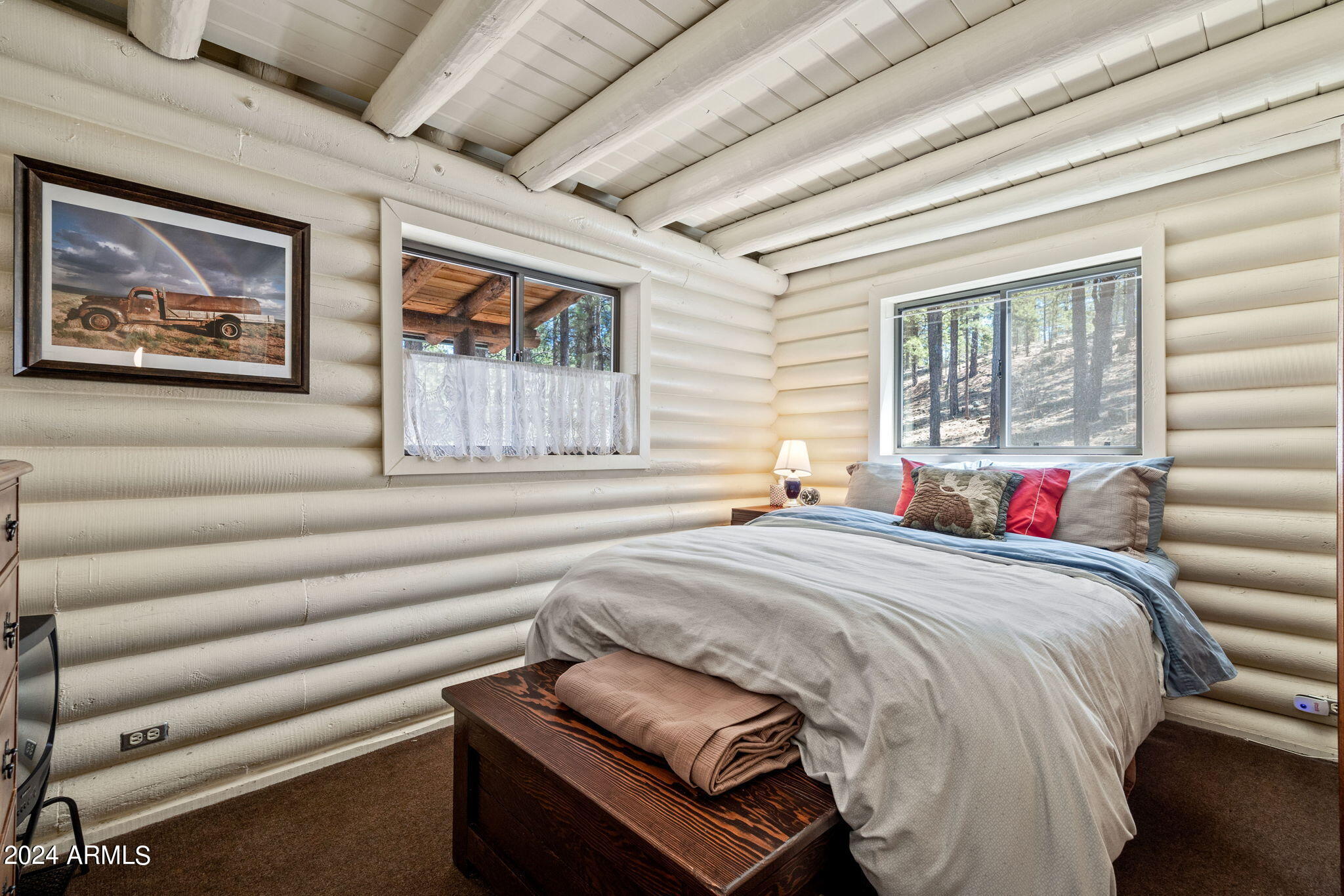 9 County Road Greer, AZ 85927 - Photo 29 of 33 a bedroom with furniture and a large window