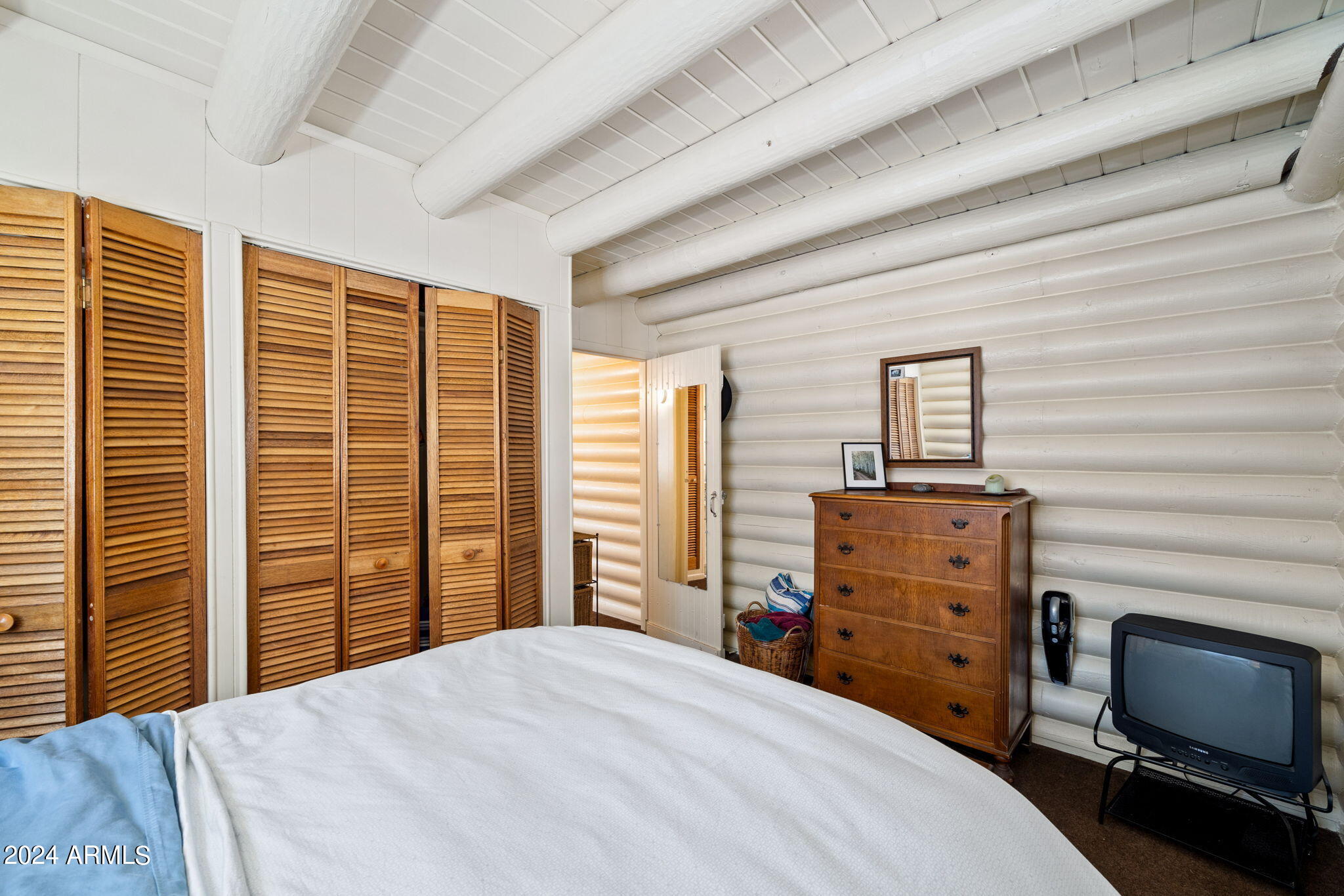 9 County Road Greer, AZ 85927 - Photo 30 of 33 a bedroom with a bed and a television
