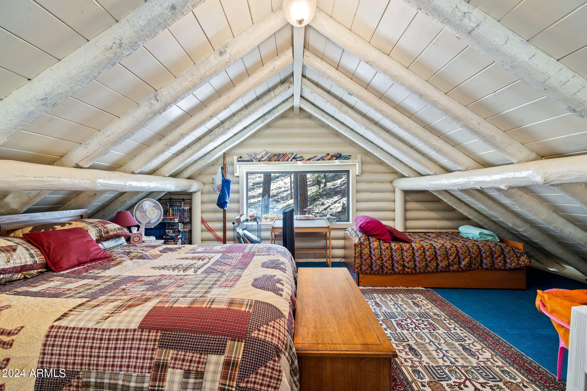 9 County Road Greer, AZ 85927 - Photo 32 of 33 a bedroom with furniture and a chandelier