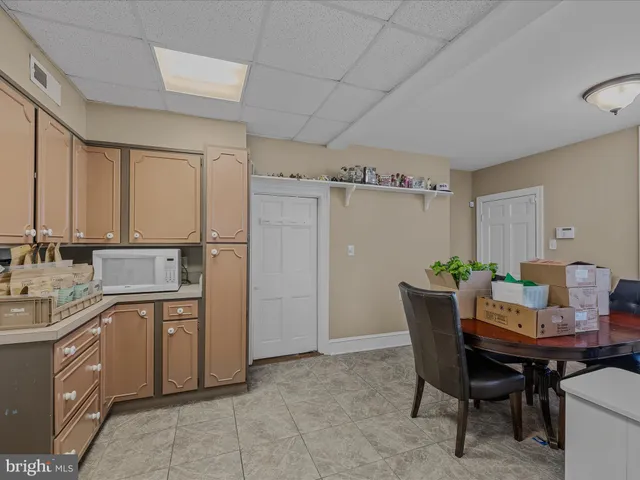 a view of a kitchen area with furniture and window