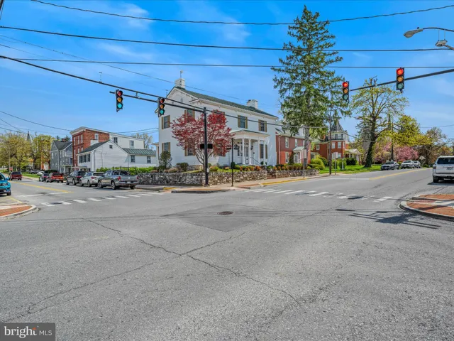 a view of a street with cars