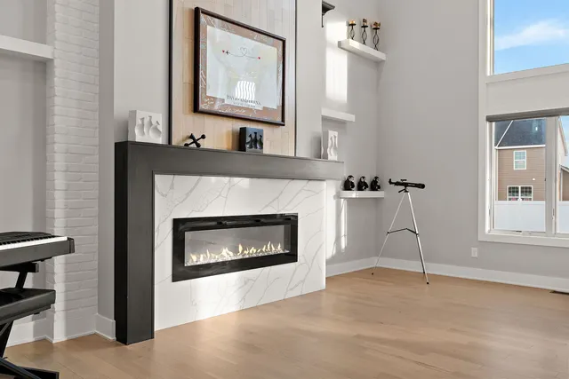 a living room with furniture and a fireplace