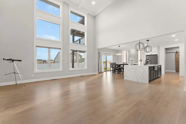 a view of a kitchen with furniture and wooden floor