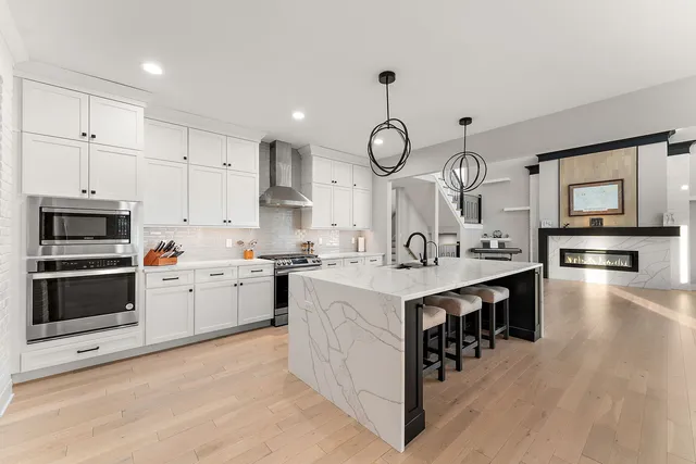 a kitchen with a sink cabinets and stainless steel appliances