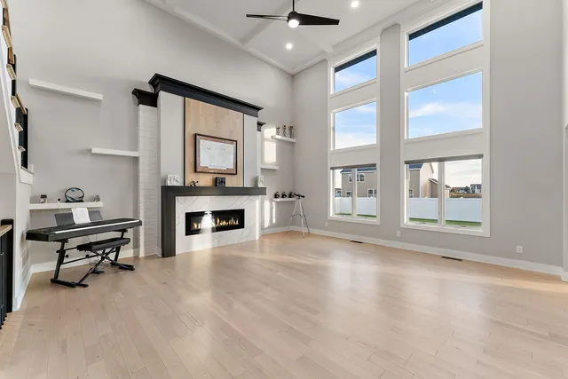 a view of a livingroom with a fireplace and window