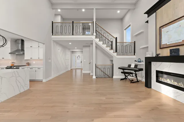 a view of kitchen and living room with a fireplace