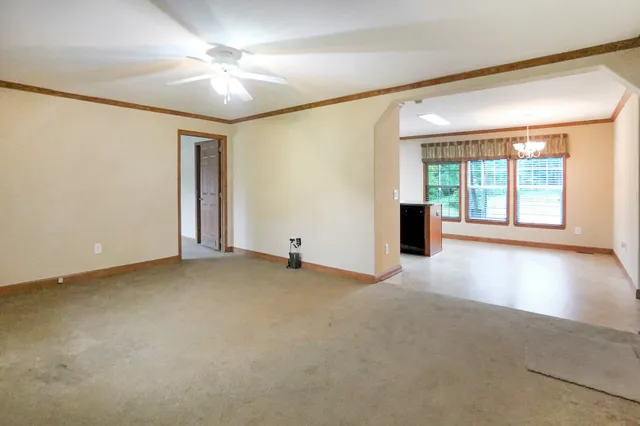 a view of a kitchen with a sink a refrigerator and a stove top oven