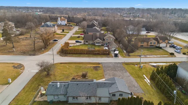 an aerial view of a house with a swimming pool