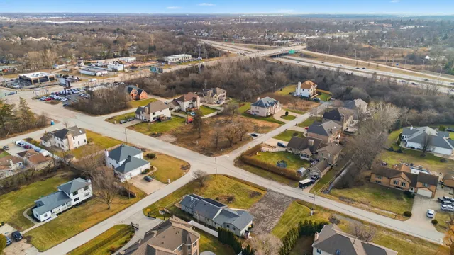 an aerial view of residential houses with outdoor space