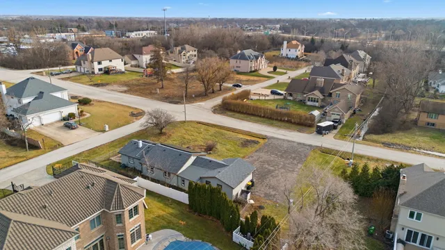 an aerial view of a house with outdoor space