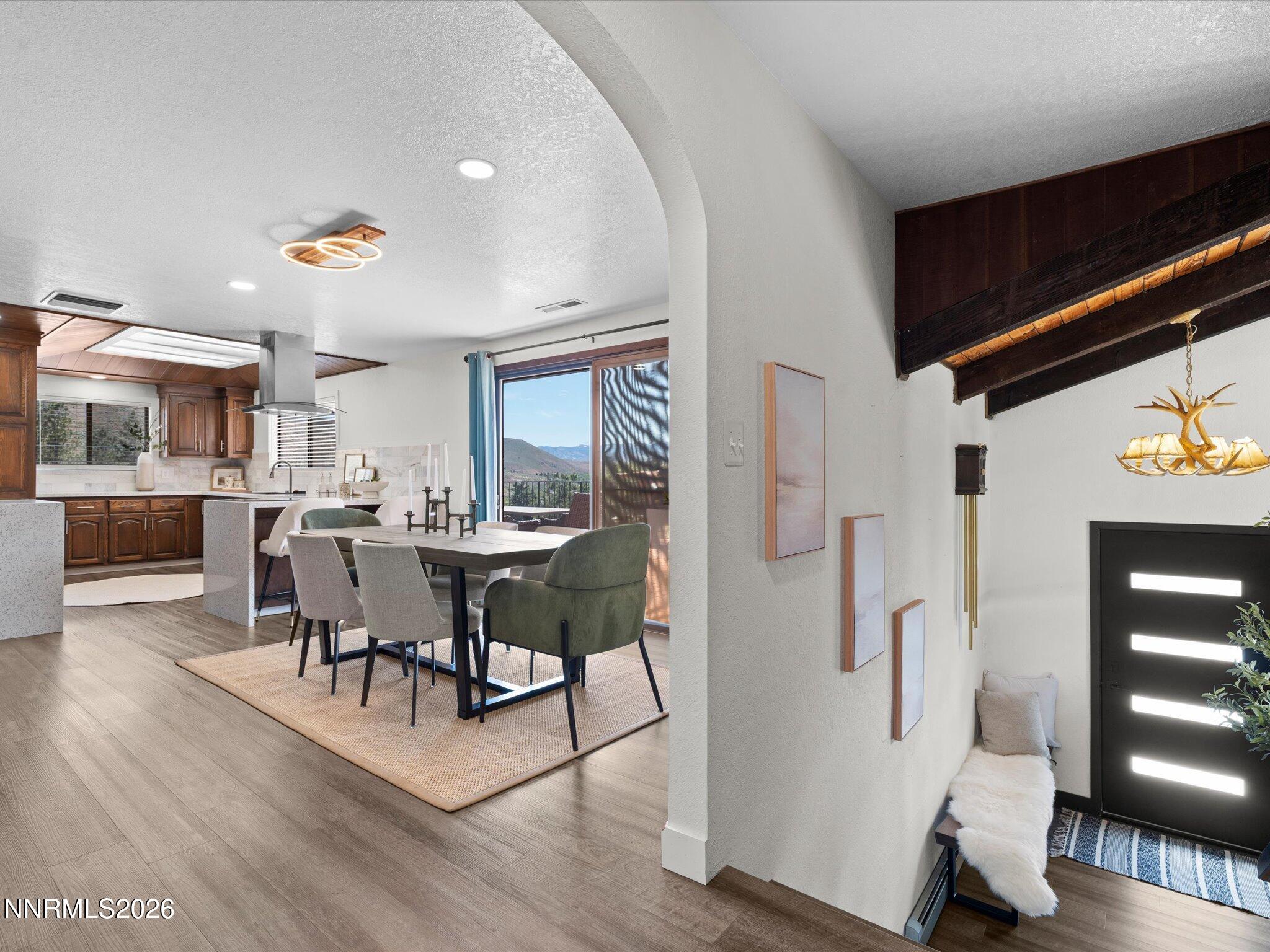 20449 Temelec Way Reno, NV 89521 - Photo 17 of 65 a view of a dining room with furniture and wooden floor