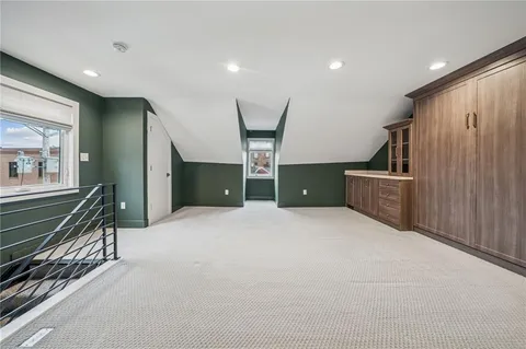 a view of a kitchen with a sink and cabinets