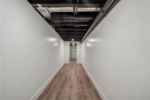 a view of empty room with wooden walls
