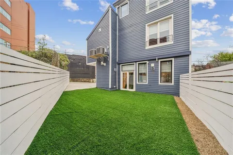 a view of a back yard of the house