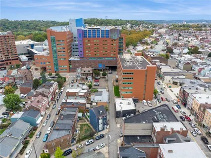 an aerial view of city and lake