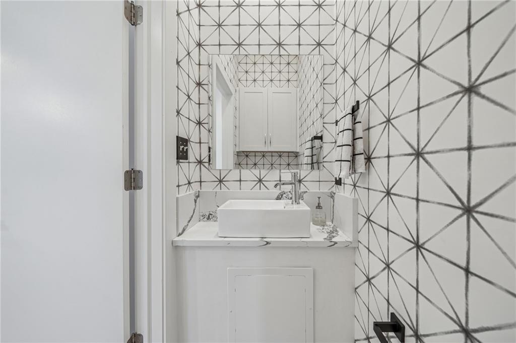 469 42nd Street Pittsburgh, PA 15201 - Photo 8 of 34 a bathroom with a sink and a mirror