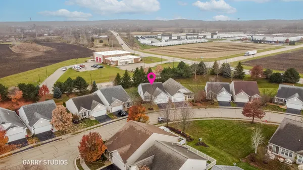an aerial view of a house with outdoor space