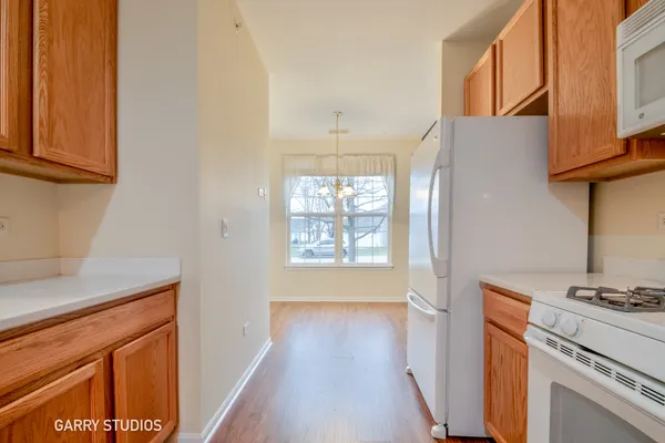 a kitchen with a stove a sink and a refrigerator