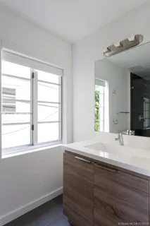 a room with a bed and a window