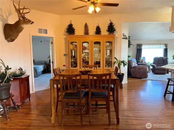 a view of a dining room with furniture window and wooden floor