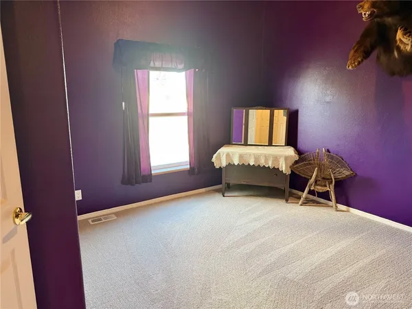a room with a bed and window