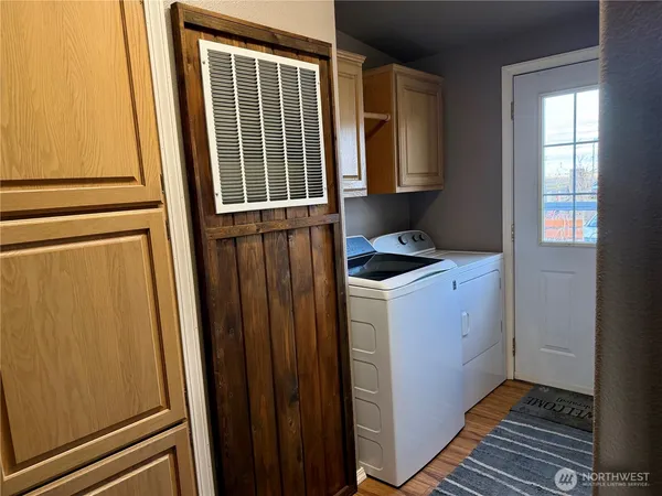 a utility room with window washer and dryer
