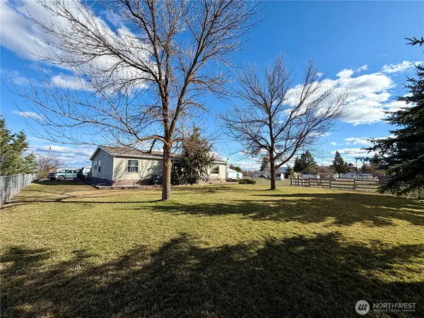 a view of a swimming pool with an outdoor space and seating area