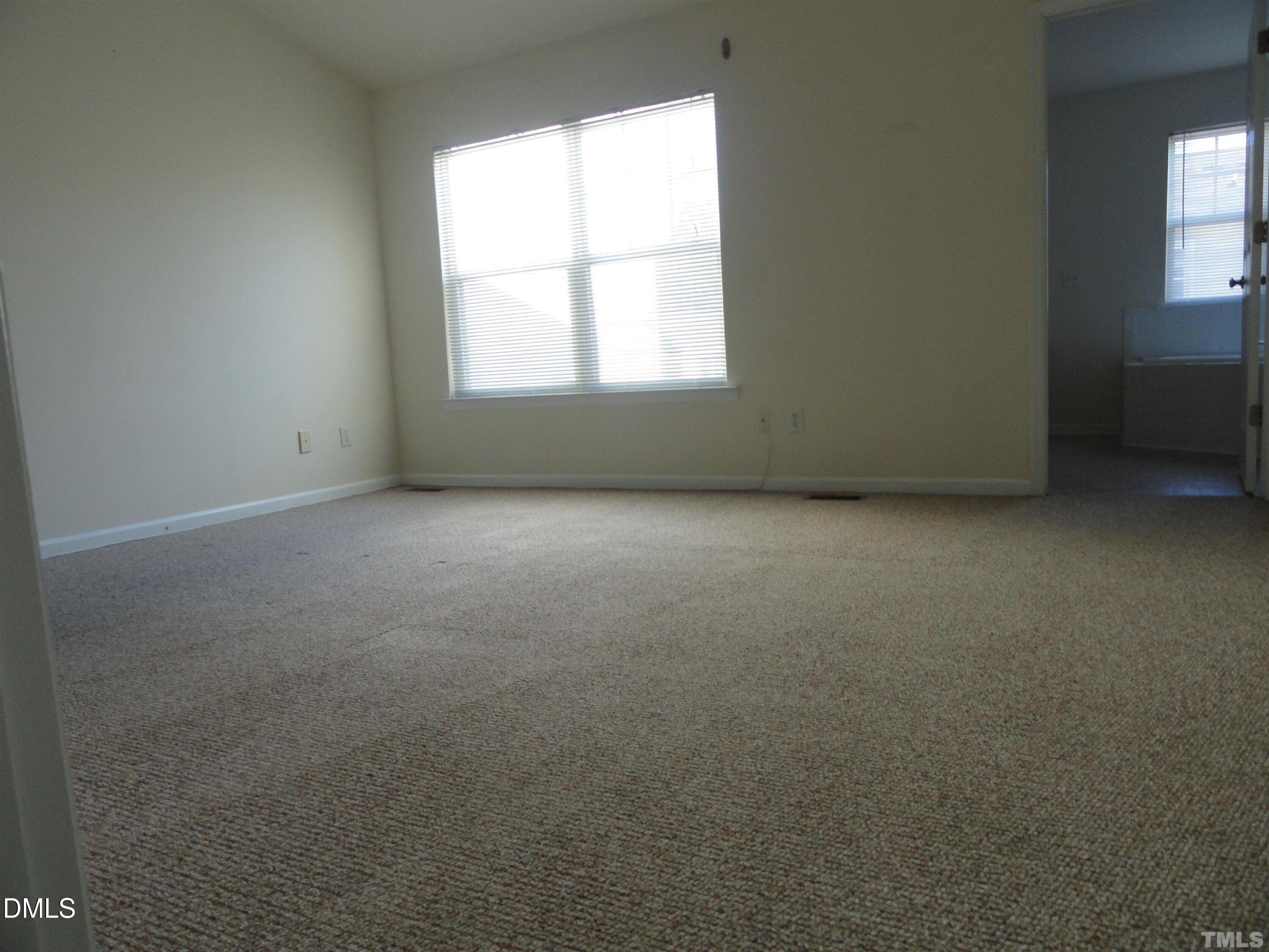 1532 Haywards Heath Lane Apex, NC 27502 - Photo 11 of 26 an empty room with a window