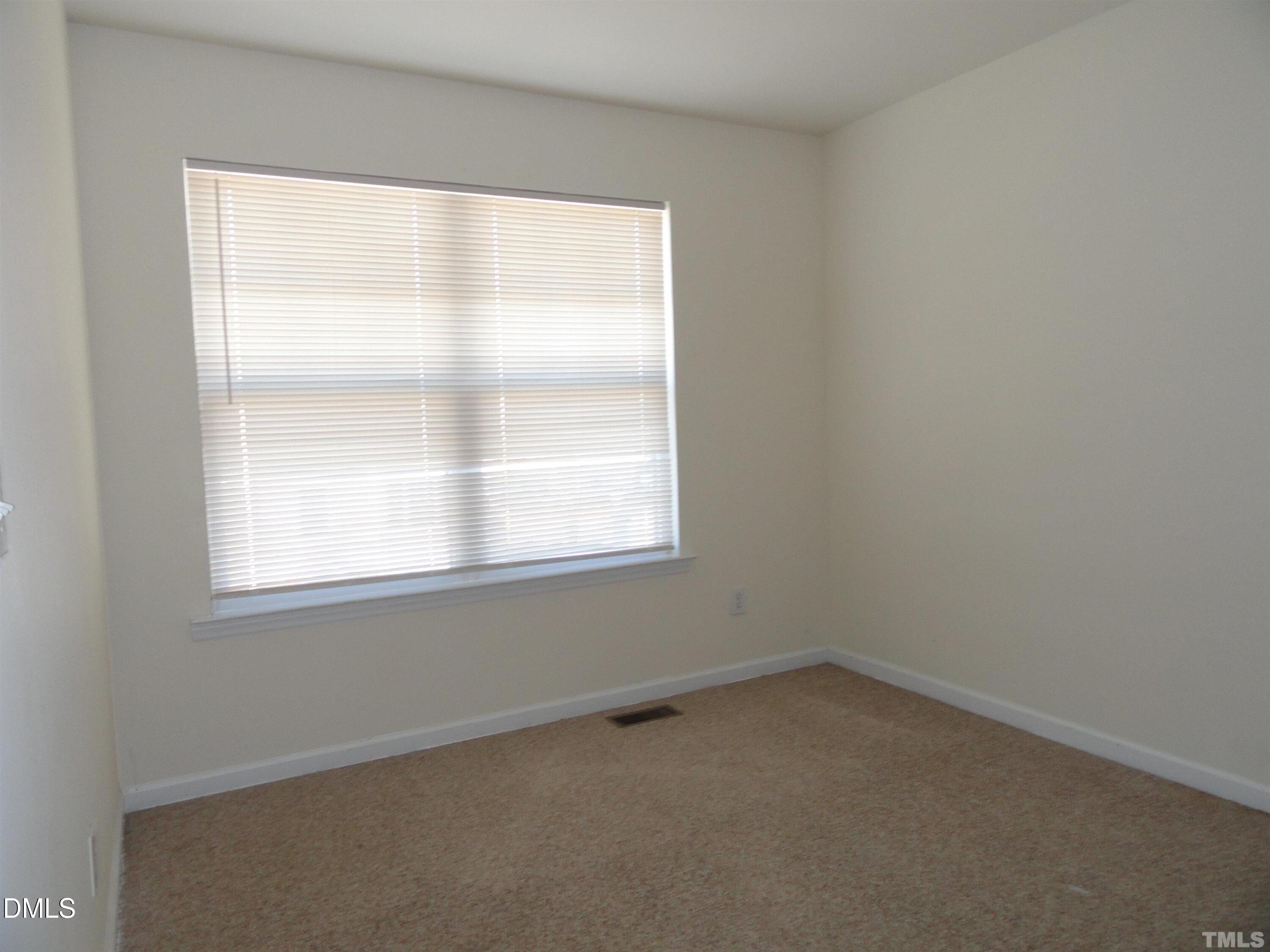 1532 Haywards Heath Lane Apex, NC 27502 - Photo 17 of 26 an empty room with a window