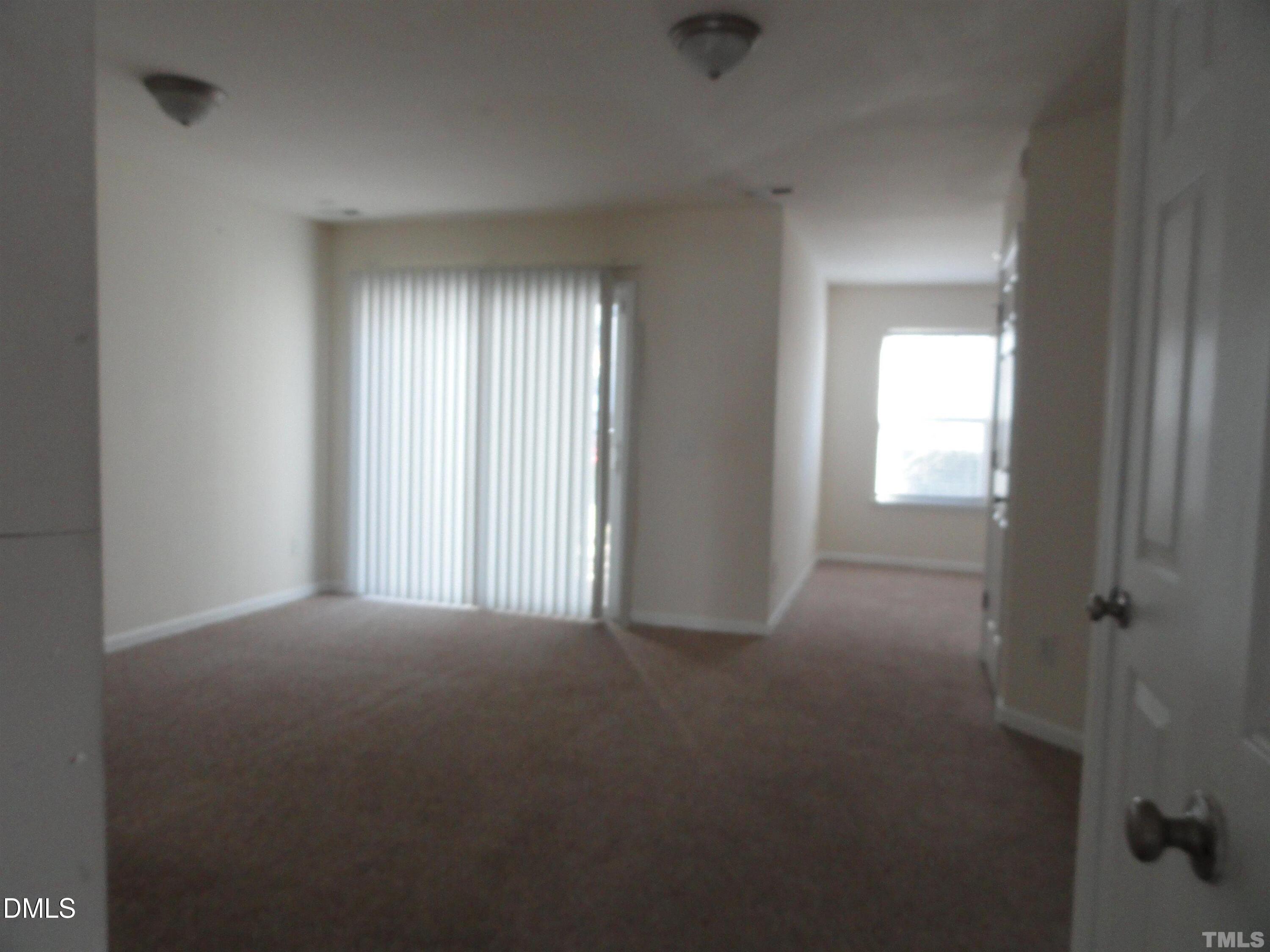 1532 Haywards Heath Lane Apex, NC 27502 - Photo 19 of 26 an empty room that has a window in it