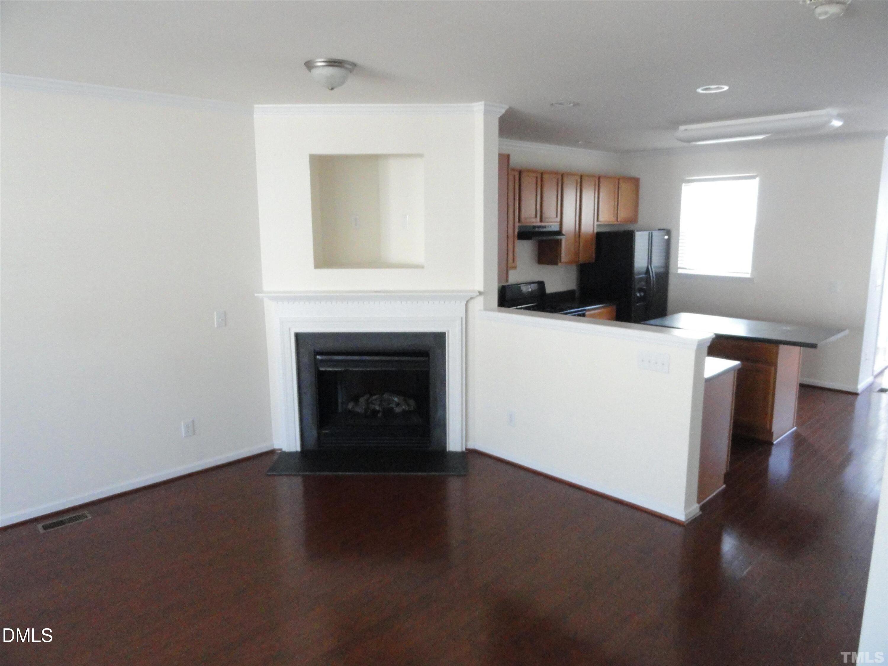 1532 Haywards Heath Lane Apex, NC 27502 - Photo 2 of 26 a view of a livingroom with a fireplace