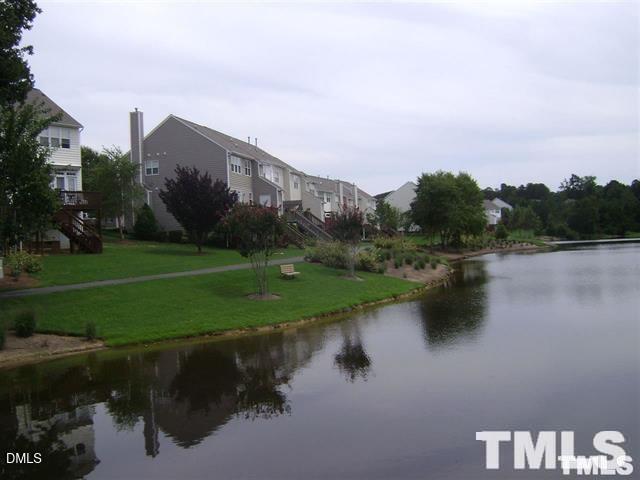 1532 Haywards Heath Lane Apex, NC 27502 - Photo 21 of 26 a view of a lake with a yard