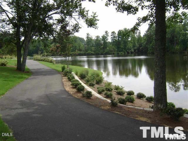 1532 Haywards Heath Lane Apex, NC 27502 - Photo 23 of 26 a view of a lake with a street
