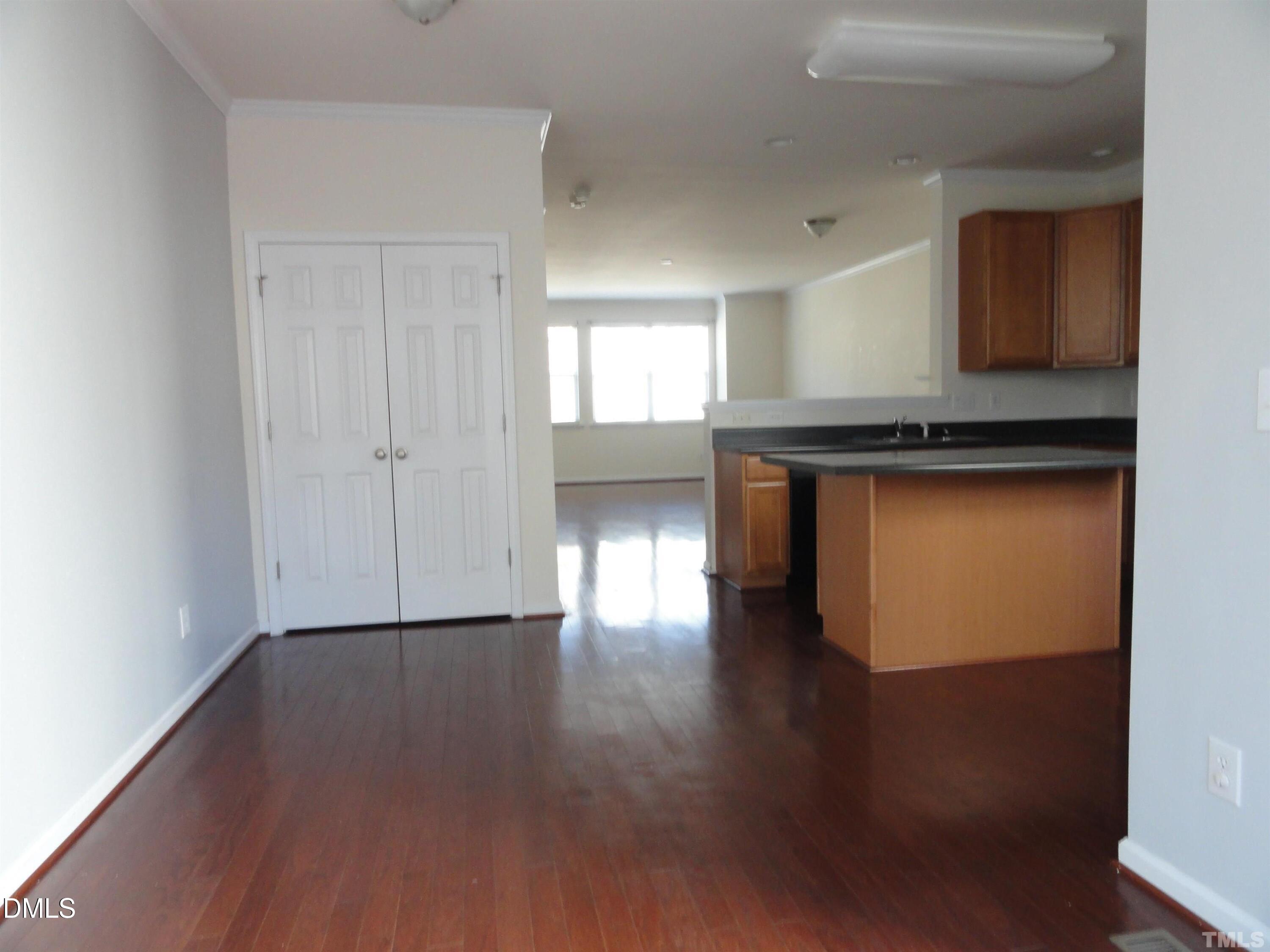 1532 Haywards Heath Lane Apex, NC 27502 - Photo 10 of 26 a living room with wooden floor and furniture