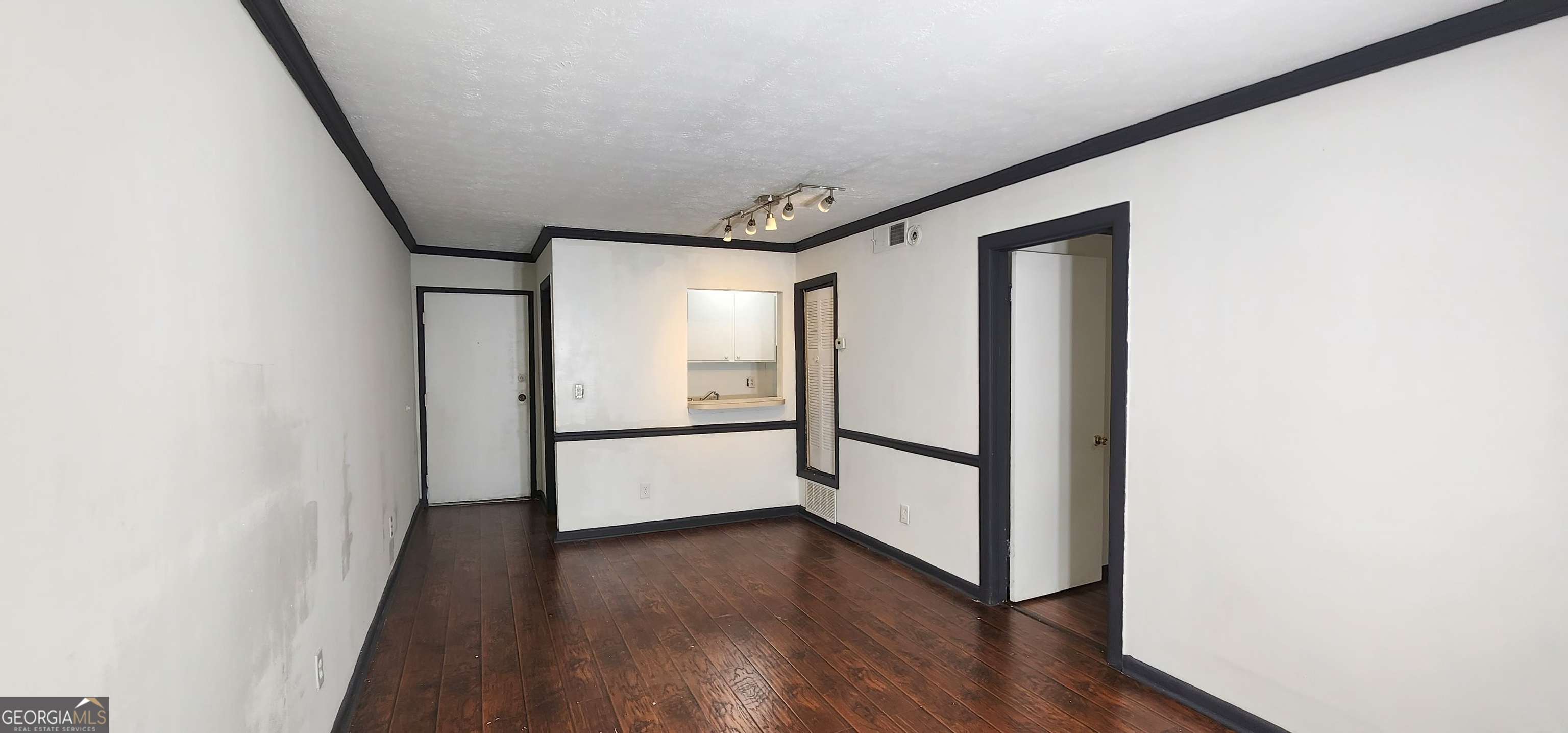2805 Northeast Expressway Northeast, Unit B36 Atlanta, GA 30345 - Photo 13 of 30 a view of a hallway with wooden floor