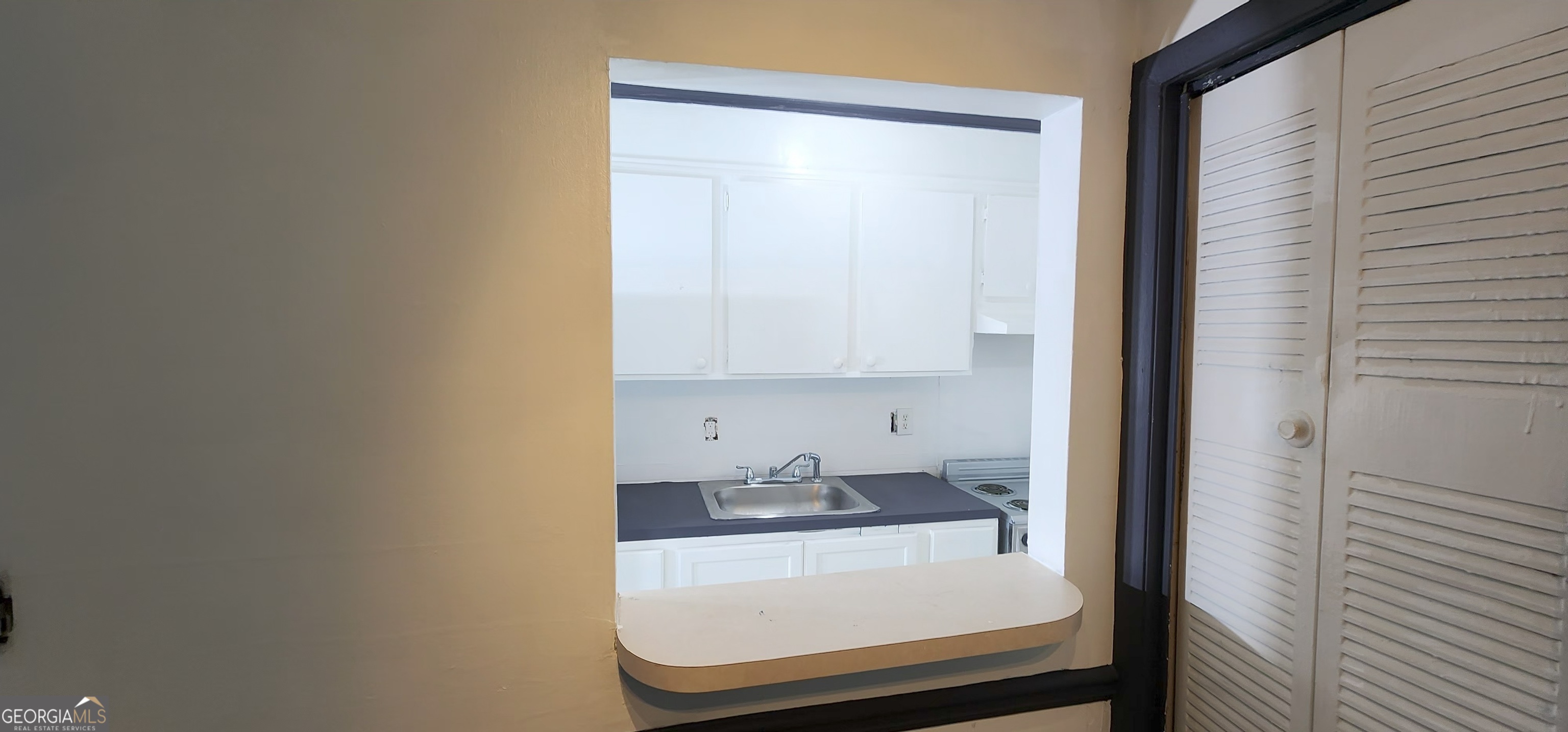 2805 Northeast Expressway Northeast, Unit B36 Atlanta, GA 30345 - Photo 7 of 30 a bathroom with a sink and a mirror