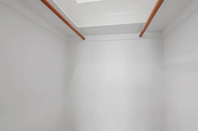 a view of staircase with white walls