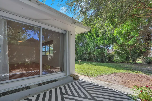 a view of a door and a window