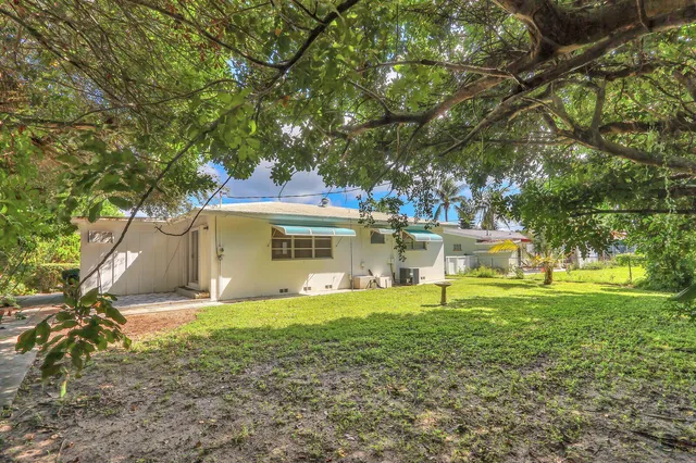 a view of a house with a big yard