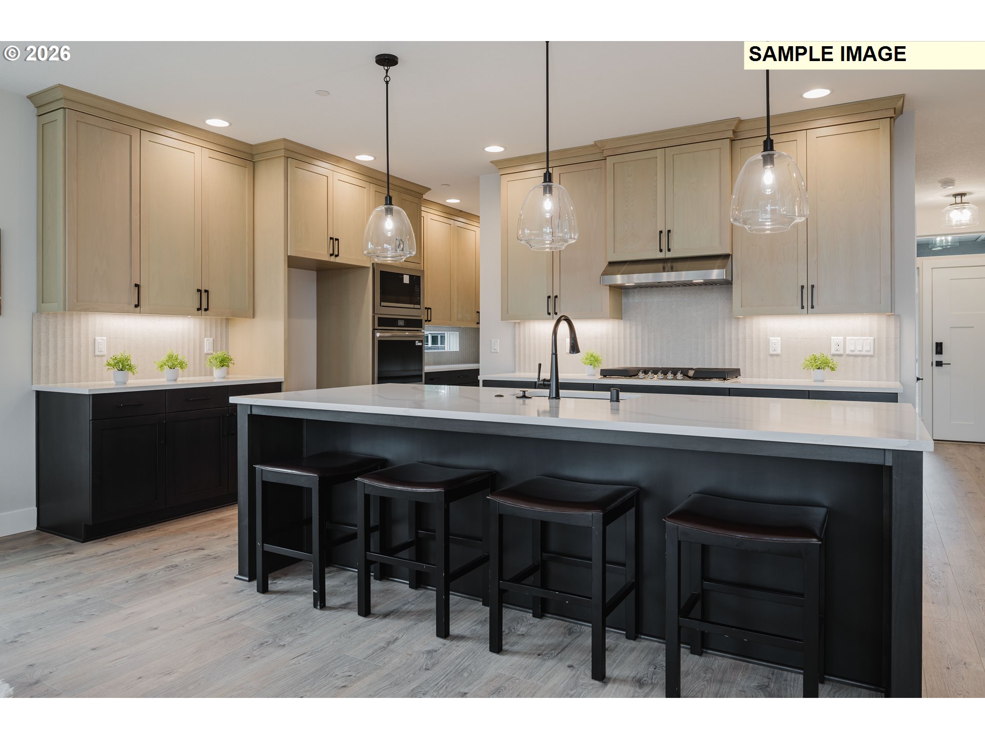 1403 North 41st Place Ridgefield, WA 98642 - Photo 8 of 30 a kitchen with a sink cabinets and wooden floor