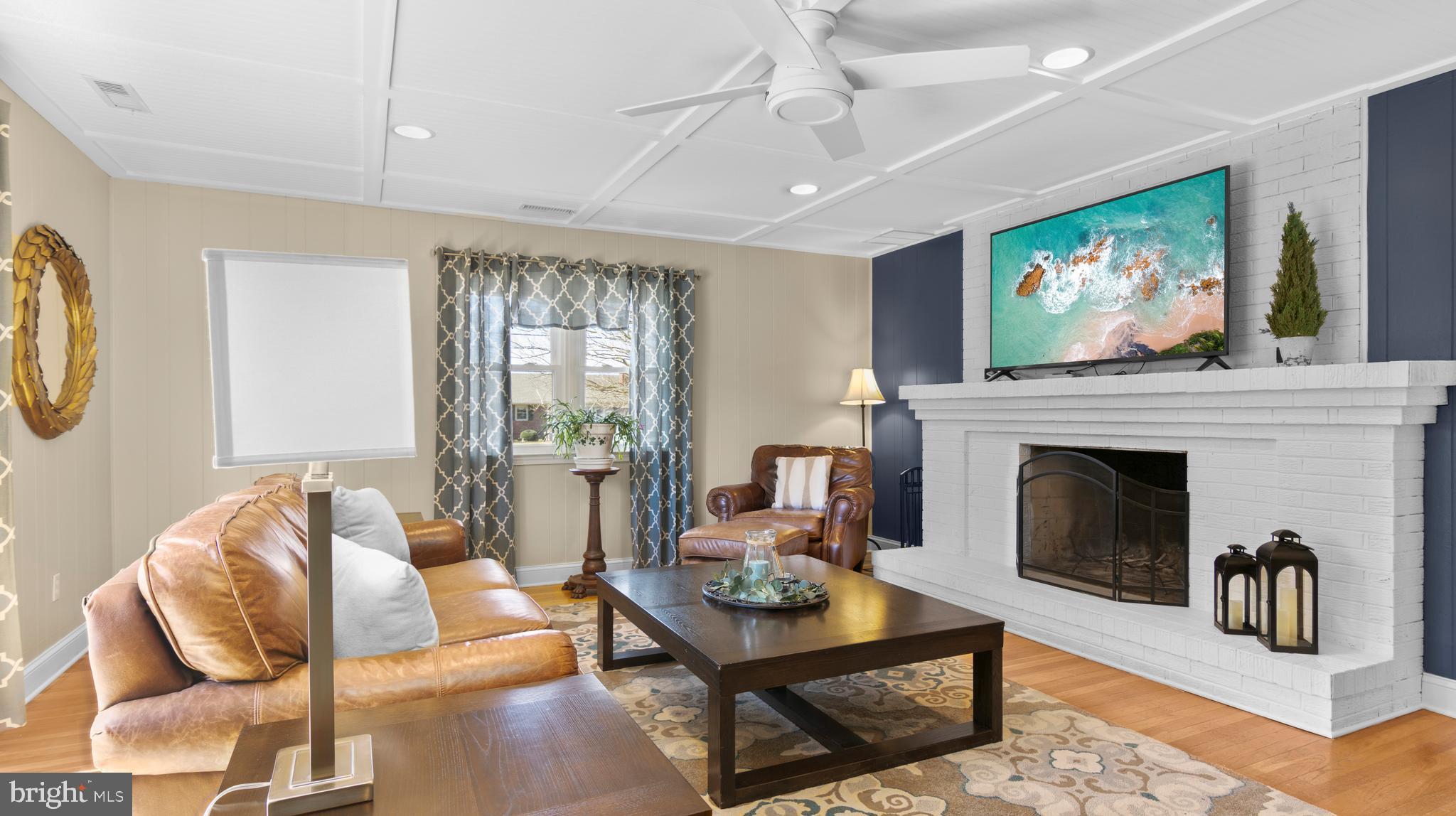 5505 Whitehall Road Cambridge, MD 21613 - Photo 13 of 44 a living room with furniture and a fireplace