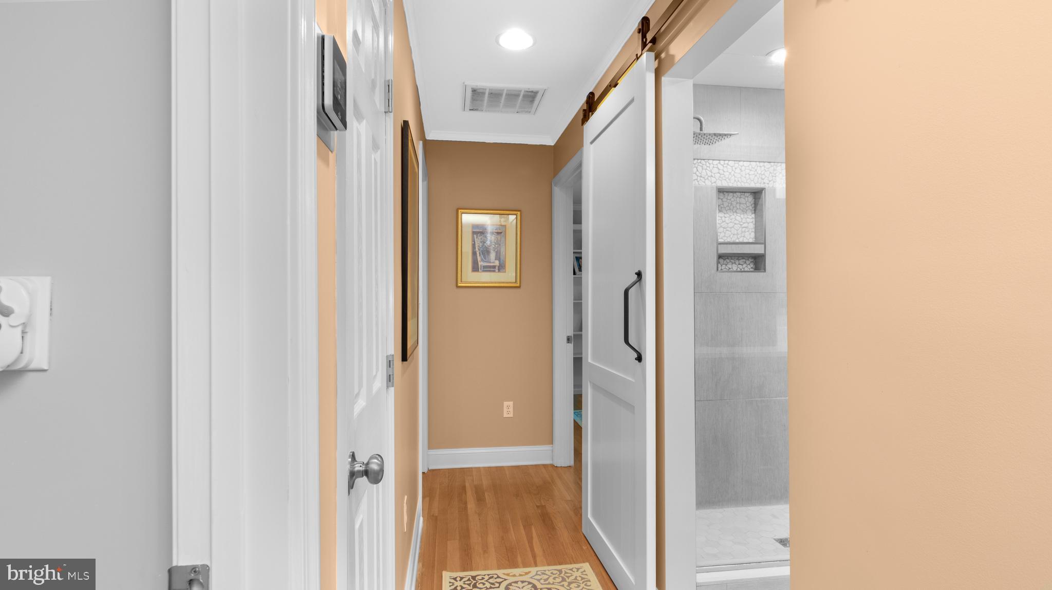 5505 Whitehall Road Cambridge, MD 21613 - Photo 17 of 44 a view of a hallway with wooden floor